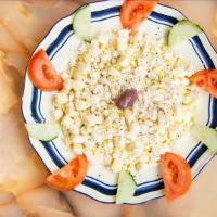 Feta Salad · Diced feta cheese, parsley, tomatoes and olive oil.