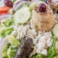 Greek Salad · Lettuce, tomato, grape leaves, onions, mushrooms, peppers, cucumber, artichoke hearts, olive...