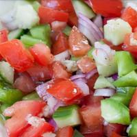 Shepherd Salad · Fresh tomatoes, cucumber, onions, green peppers, parsley and dressing.