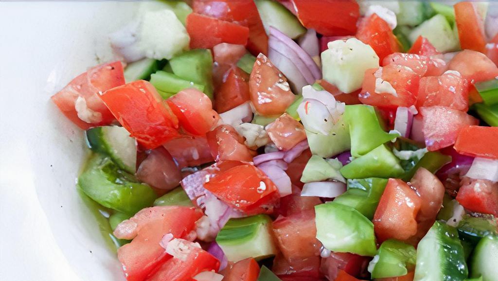 Shepherd Salad · Fresh tomatoes, cucumber, onions, green peppers, parsley and dressing.