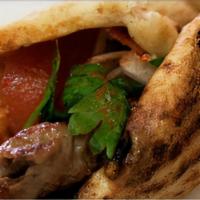 Kofte Kebab Sandwich · Served with lettuce, onion, tomato and special sauce.
