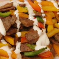 Doner Lamb Gyro · Layers of marinated ground meat thighs wrapped around the large vertical spit and grilled th...