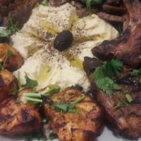 Mixed Grill · Assortment of shish, adana, gyro and lamb chops. Served with rice or hummus or babaghanouj, ...