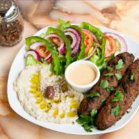 Lamb Adana · Chopped grilled on skewers lamb flavored with red bell peppers, gently spiced with paprika a...