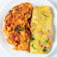 Western Omelet (Platter) · Beaten eggs that are folded over a filling.