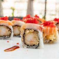 Torr Peter Roll · Shrimp tempura topped with yellowtail, salmon, and masago.