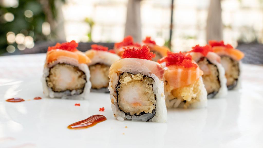 Torr Peter Roll · Shrimp tempura topped with yellowtail, salmon, and masago.