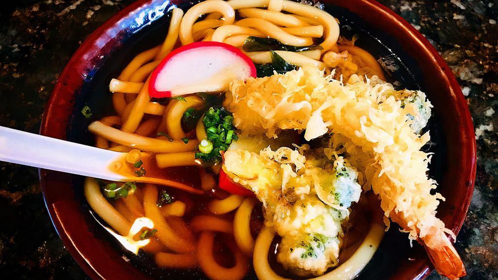 Tempura Udon · Japanese thick noodles in soup with kani, shrimp & vegetable tempura.