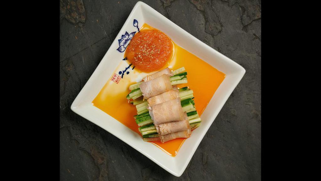 Sliced Pork Belly In Garlic Sauce · Fine pork belly paired with crunchy cucumber, protein plus veggie, dip in special hot sauce. The luxuriant but refreshing sensation that lingers in the mouth. Sliced pork belly with chili garlic sauce.