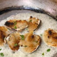 Baked Clams Oreganata · Baked clams seasoned with breadcrumbs and finished with white wine sauce