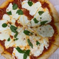 Traditional Margherita Pizza · Tomato sauce, fresh mozzarella, basil