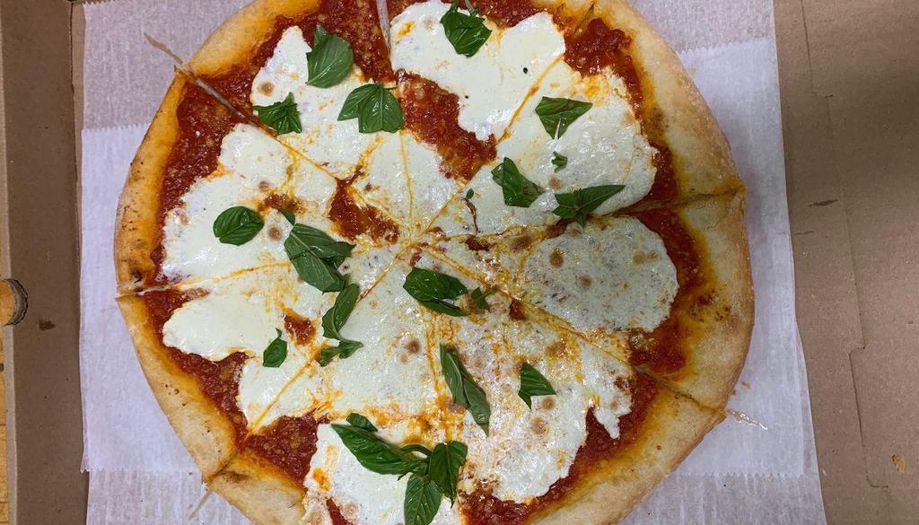 Traditional Margherita Pizza · Tomato sauce, fresh mozzarella, basil