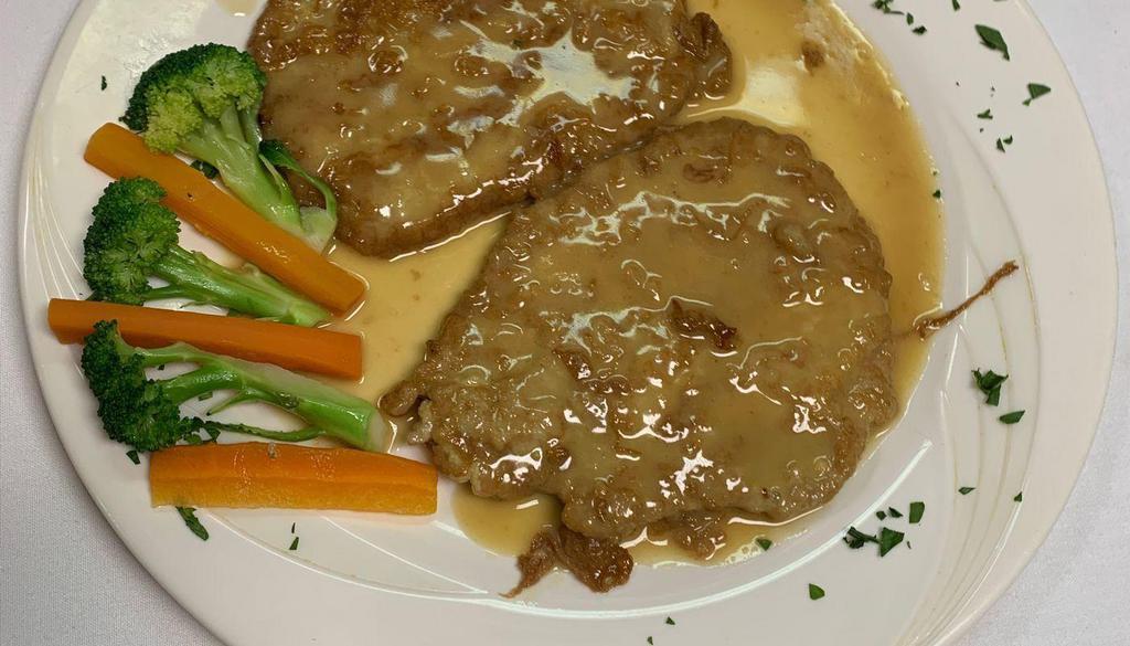 Veal Francese · Lightly battered veal scaloppini sauteed in lemon, butter, and white wine sauce