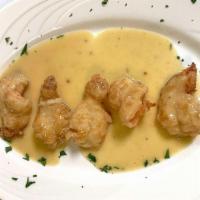 Shrimp Al Vino Blanco · Delicately flavored sautéed shrimp with garlic and white wine, served with mixed vegetables