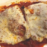 Chicken Parmigiana · Chicken cutlet topped with mozzarella and tomato sauce, served with mixed vegetables