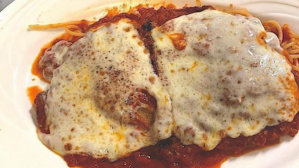 Chicken Parmigiana · Chicken cutlet topped with mozzarella and tomato sauce, served with mixed vegetables