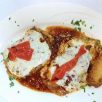 Chicken Milano · Chicken filets with eggplant, ham, roasted red peppers, and mozzarella in sherry wine, light...
