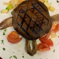 [Gf, V, Vn] Grilled Portobello Mushroom · Served over sauteed mixed vegetables