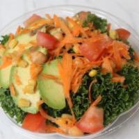 Chickpea-Kale · Kale, avocado, chickpeas, carrots, corn, and tomatoes, with carrot ginger dressing.