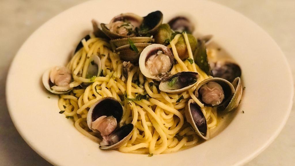 Spaghetti Alle Vongole Veraci · Homemade thin spaghetti with fresh baby clams, garlic, and olive oil.