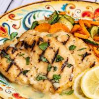 Pollo Al Limone · Sauteed chicken breast in lemon sauce served with sauteed zucchini and carrots.