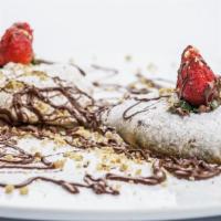 Calzone Alla Nutella · Two small calzone with ricotta cheese and nutella.