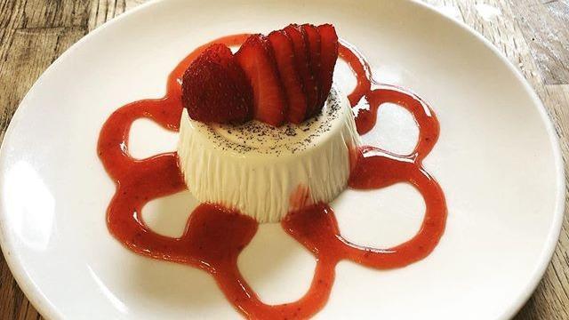Panna Cotta Alle Fragole · Homemade pudding topped with strawberry.