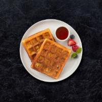 Waffle Whiz · Classic homemade waffles served with maple syrup.