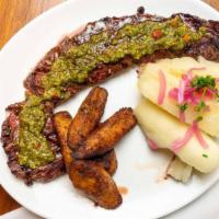 Churrasco · Peruvian skirt steak, yucca mash, sweet plantains, salsa criolla