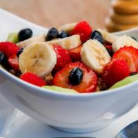 Greek Yogurt · Greek yogurt with seasonal fresh fruit and granola, drizzled with honey.