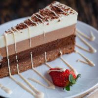 Triple Chocolate Cake · Three layers of chocolate mousse, with Nutella and ground biscuit crust.