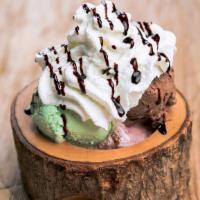 Ice Cream Sundae · Three scoops of your choice of ice cream, topped with whipped cream, chocolate syrup, and a ...