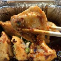 Spicy Mini Pork And Mushroom Dumpling · 8 pcs mini dumpling in special house-made spicy chili oil, garlic, ginger.