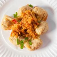 Spicy Chicken Wonton 鸡馄饨 · Organic chicken, fresh mushroom, celery and onion in wonton wrap. Mixed in special house mad...