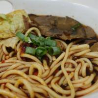 Beef Noodle Soup 牛汤面 · Braised beef and veggie in house made Beef Broth with Chinese spices.  Little spicy.