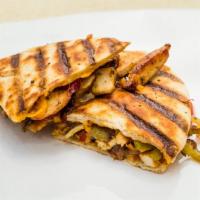 Chicken Fajita · Grilled chicken, cheddar cheese, roasted peppers, caramelized onions, salsa.