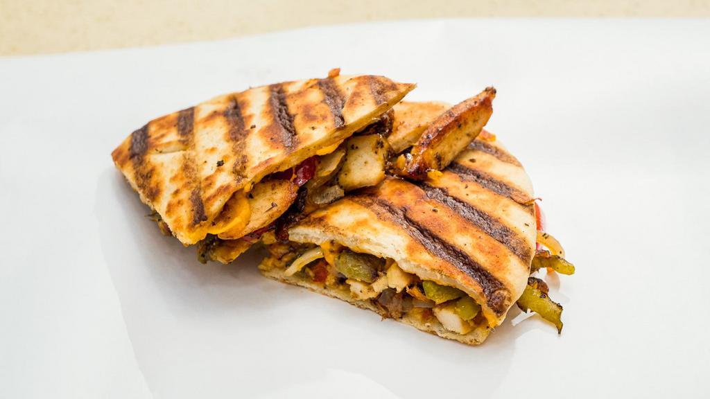 Chicken Fajita Panini · Grilled chicken, Cheddar cheese, roasted peppers, caramelized onions and salsa.