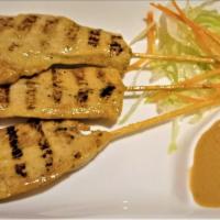Chicken Satay · Thai style, sliced charcoal-grilled strips of chicken, marinated in lemongrass, and imported...