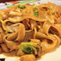 Pad Se-Ew · A wide rice noodle sautéed in a light soy sauce with cabbage, broccoli, mushroom, and carrot.