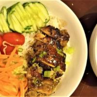 Roasted Chicken Bowl · Chicken thigh marinated in freshly ground lemongrass served with cucumber slices, tomato, ci...