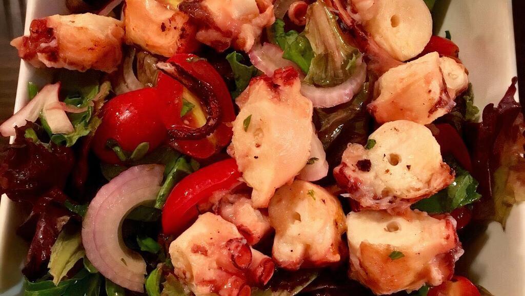 Octopus Salad · Octopus, Mediterranean greenstuff, onion, cherry tomato.
