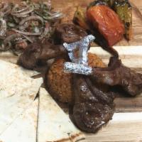 Meyhane Lamb Chops · 4 pieces lamb chops comes with french fries onion salad grilled tomato green pepper and pita...