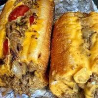 Cheesesteak · 10 ounces of thinly sliced USDA prime beef, cheese whiz and fried onions.