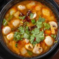 Tom Yum Soup · Mushroom and cilantro in spicy lime lemongrass, Thai herbs broth