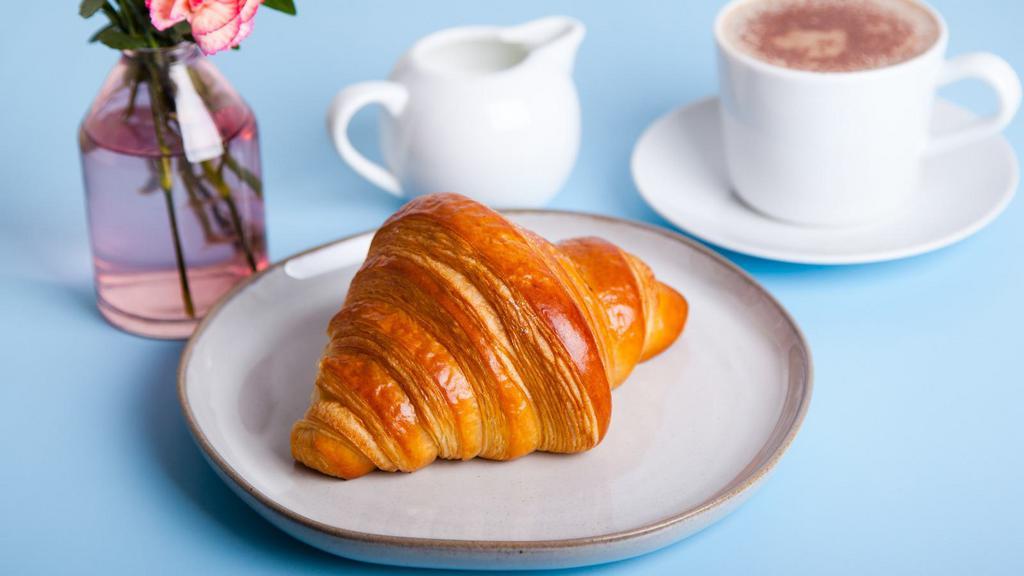 Croissant · Freshly baked Croissant with a flaky, buttery texture.