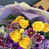 Wrapped Bouquet · Seasonal Bouquet of fresh flowers wrapped beautifully in seasonal colors.  The picture is an...