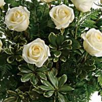 12 White Rose Bouquet   · 12 long stem white roses with seasonal greens and babies breath wrapped in a bouquet in a va...