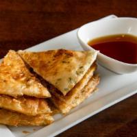 Scallion Pancake · Savory light flakey pancakes sliced in wedges with sweet kung pao sauce, good for kids and b...