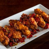 Dry Pepper Chicken Wings · Spicy. Six dry rubbed flat wings stir-fried with dry chili pepper, long hot peppers, sichuan...