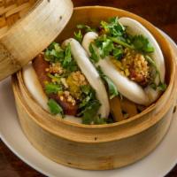 Pork Belly Buns (2Pc) · Not Spicy. Braised pork belly in bao buns topped with cilantro, crushed peanuts and pickled ...